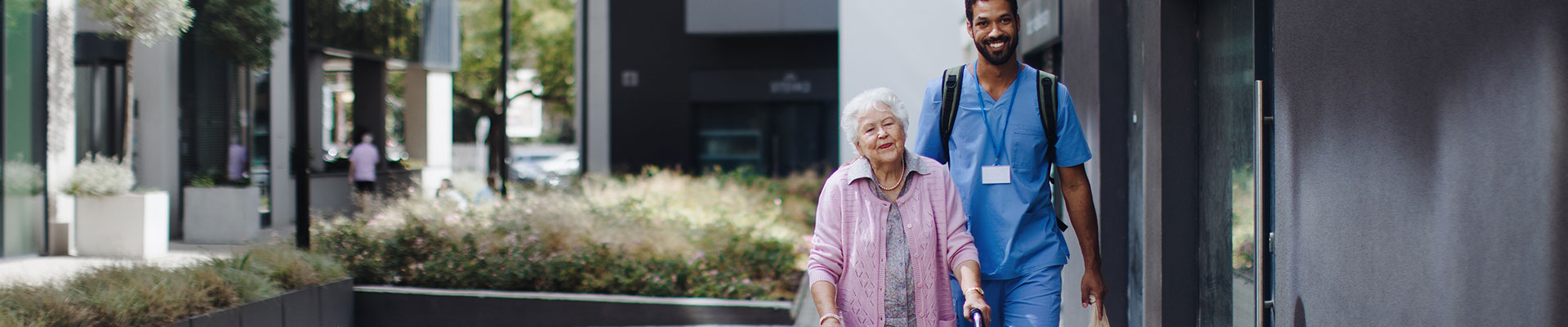 Caregiver and client on a walk